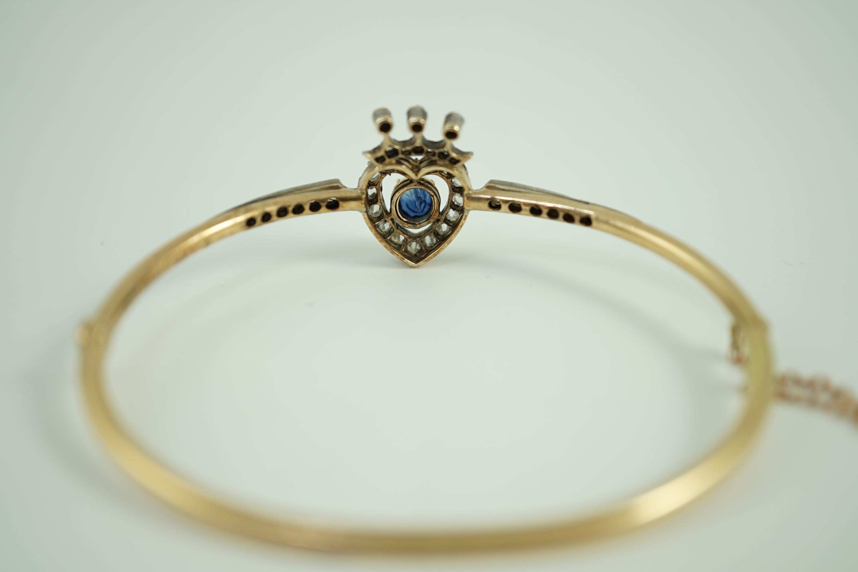 A 19th century gold, sapphire and rose cut diamond set hinged bangle